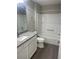 Clean bathroom featuring granite countertop, shower-tub combo, and modern fixtures at 928 Nuthatch Ave, The Villages, FL 32163