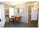 Bright dining area with glass table and four chairs at 227 Pinewood Dr, Eustis, FL 32726