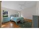 Main bedroom with light wood floors and a ceiling fan at 25813 Glen Eagle Dr, Leesburg, FL 34748