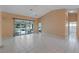 Living room with sliding doors leading to the patio at 25813 Glen Eagle Dr, Leesburg, FL 34748