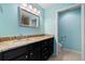 Bathroom boasts light blue walls, granite countertops, and walk-in shower at 26701 Bimini Dr, Tavares, FL 32778