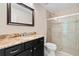 Bathroom with granite countertop vanity and large walk-in shower at 26701 Bimini Dr, Tavares, FL 32778