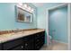 Bathroom featuring granite countertops, sleek vanity, and ample lighting at 26701 Bimini Dr, Tavares, FL 32778