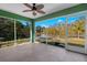 Spacious screened patio overlooking a serene canal at 26701 Bimini Dr, Tavares, FL 32778