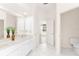 Bathroom with double vanity and view into another room at 6178 Spinnaker Loop, Lady Lake, FL 32159