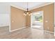 Dining room with wood-look floors and access to a sunroom at 6178 Spinnaker Loop, Lady Lake, FL 32159