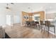 Dining room with a view, hardwood floors, and modern light fixture at 6178 Spinnaker Loop, Lady Lake, FL 32159