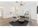 Bright living room with large windows and neutral decor at 6178 Spinnaker Loop, Lady Lake, FL 32159