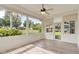 Sunroom with large windows and view of backyard at 6178 Spinnaker Loop, Lady Lake, FL 32159