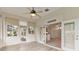 Sunroom with backyard access and view into dining area at 6178 Spinnaker Loop, Lady Lake, FL 32159