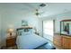 Bright bedroom with wood furniture and a comfy bed at 1314 Lajolla Cir, The Villages, FL 32159