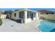 Backyard oasis with pool, patio, and screened enclosure at 1314 Lajolla Cir, The Villages, FL 32159