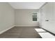 This bedroom features neutral walls, carpet floors, a window, and a closet at 14255 Crest Palm Ave, Windermere, FL 34786