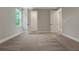 Bedroom featuring great natural light, an en suite bathroom and a spacious closet at 14255 Crest Palm Ave, Windermere, FL 34786