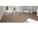 A large bonus room featuring hardwood floors, natural light, and a convenient wet bar for entertaining guests at 14255 Crest Palm Ave, Windermere, FL 34786