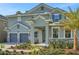 Charming home with stone accents, well-maintained landscaping, and a covered entryway at 14255 Crest Palm Ave, Windermere, FL 34786