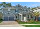 Stunning two-story home featuring a two-car garage and a beautifully landscaped front yard at 14255 Crest Palm Ave, Windermere, FL 34786