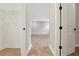 Hallway with closet views featuring light wood flooring and neutral wall colors at 14255 Crest Palm Ave, Windermere, FL 34786