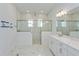 Bathroom boasts double vanity, quartz countertops and large walk-in shower at 14256 Crest Palm Ave, Windermere, FL 34786