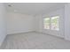 Spacious bedroom featuring neutral carpet and large windows at 14256 Crest Palm Ave, Windermere, FL 34786