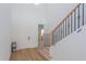 Bright entryway with light wood floors and a modern staircase with iron railings at 14256 Crest Palm Ave, Windermere, FL 34786