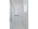 Large walk-in shower with marble tile and glass enclosure at 14256 Crest Palm Ave, Windermere, FL 34786