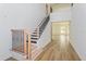 Modern staircase with light wood and dark iron railings in a two story home at 14256 Crest Palm Ave, Windermere, FL 34786