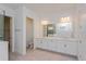 Elegant bathroom with double vanity and a large mirror at 14421 Crest Palm Ave, Windermere, FL 34786