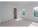 Light-filled bedroom with en-suite bathroom access at 14421 Crest Palm Ave, Windermere, FL 34786