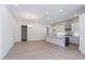 Modern kitchen with white cabinets and a large island at 14421 Crest Palm Ave, Windermere, FL 34786