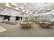 Banquet room with tables, chairs, stage, chandelier and neutral carpeting at 2440 Pawtucket Pass, Mount Dora, FL 32757