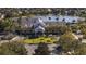 Aerial view of clubhouse and entrance with lake in background at 2440 Pawtucket Pass, Mount Dora, FL 32757