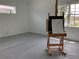 Bright, minimalist room with clean lines, natural light, and neutral tones offers versatile living space at 2440 Pawtucket Pass, Mount Dora, FL 32757
