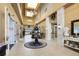 Lobby of the community clubhouse with chandelier and elegant decor at 2440 Pawtucket Pass, Mount Dora, FL 32757