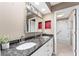 Double vanity bathroom with granite countertops at 2502 Loch Ness Ct, Leesburg, FL 34788