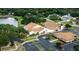 Aerial view of community clubhouse and surrounding landscape at 2502 Loch Ness Ct, Leesburg, FL 34788