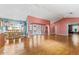 Bright dining area with hardwood floors and kitchen access at 2502 Loch Ness Ct, Leesburg, FL 34788