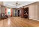 Gathering room with hardwood floors and built-in shelving at 2502 Loch Ness Ct, Leesburg, FL 34788