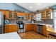 Bright kitchen with light wood cabinets and stainless steel appliances at 2502 Loch Ness Ct, Leesburg, FL 34788