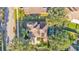 Overhead view of the home showcasing the lush landscaping and pristine pool area at 929 Magnolia Blossom Ct, Apopka, FL 32712