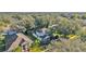 Aerial shot of the home displaying its well-maintained lawn and mature trees at 929 Magnolia Blossom Ct, Apopka, FL 32712