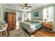 Cozy bedroom with lots of light and hardwood floors for a comfy place to unwind at 929 Magnolia Blossom Ct, Apopka, FL 32712