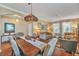 Inviting dining room featuring a large wooden table and decorative Tiffany style lighting at 929 Magnolia Blossom Ct, Apopka, FL 32712