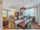 Inviting dining room featuring a large wooden table and decorative Tiffany style lighting at 929 Magnolia Blossom Ct, Apopka, FL 32712