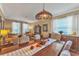 Open dining room featuring hardwood floors, lots of light and comfortable seating at 929 Magnolia Blossom Ct, Apopka, FL 32712