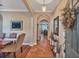Welcoming entryway with a decorative wreath, stylish console table, and an archway to other rooms at 929 Magnolia Blossom Ct, Apopka, FL 32712