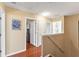 Upstairs hallway featuring hardwood floors and natural light with access to bedrooms and bathrooms at 929 Magnolia Blossom Ct, Apopka, FL 32712