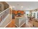 Open kitchen featuring wooden cabinets, a breakfast bar, and an adjacent dining area at 929 Magnolia Blossom Ct, Apopka, FL 32712