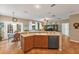 Bright and airy kitchen with island sink, stainless steel dishwasher, and open flow to breakfast area at 929 Magnolia Blossom Ct, Apopka, FL 32712