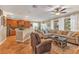 Open-concept living room with adjacent kitchen area, lots of light and comfortable seating at 929 Magnolia Blossom Ct, Apopka, FL 32712